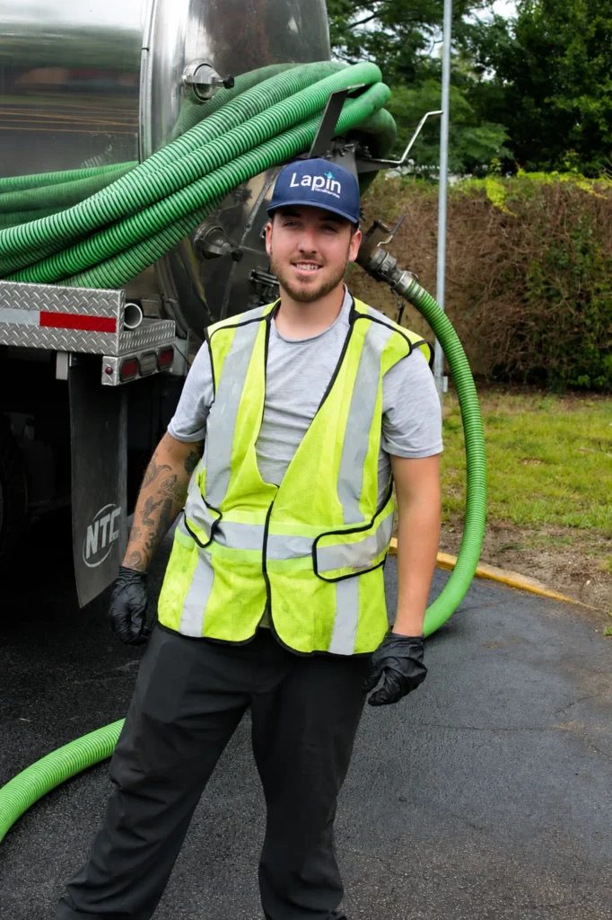 Lapin Services technician explaining drain inspection findings to a homeowner