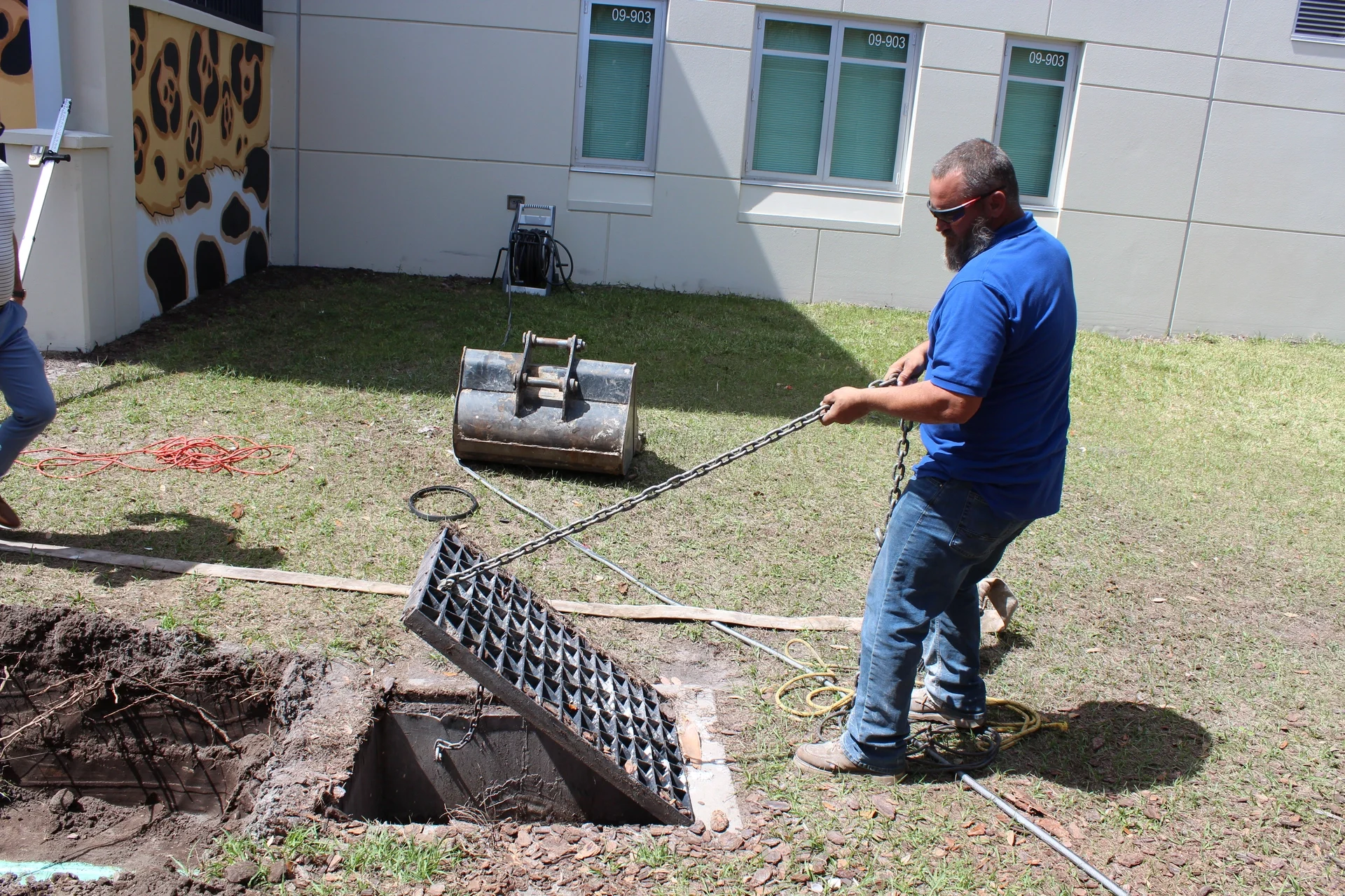 Lapin Services technician using indoor drain camera equipment to find a plumbing odor source